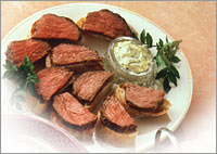 Marinated Fillet of Beef with Herb Dressing on Crusty Bread