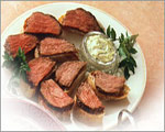 Marinated Fillet of Beef with Herb Dressing on Crusty Bread